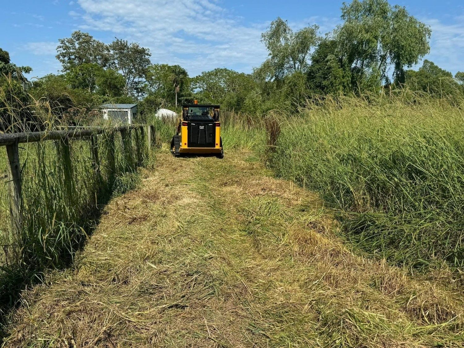A Yellow Skid Steer Mower — Ovannah Hire In West Kempsey, NSW