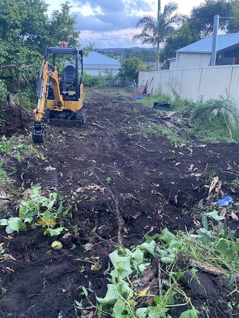 Yellow Excavator on a Dirt Plot of Land, Clearing Brush — Ovannah Hire In West Kempsey, NSW