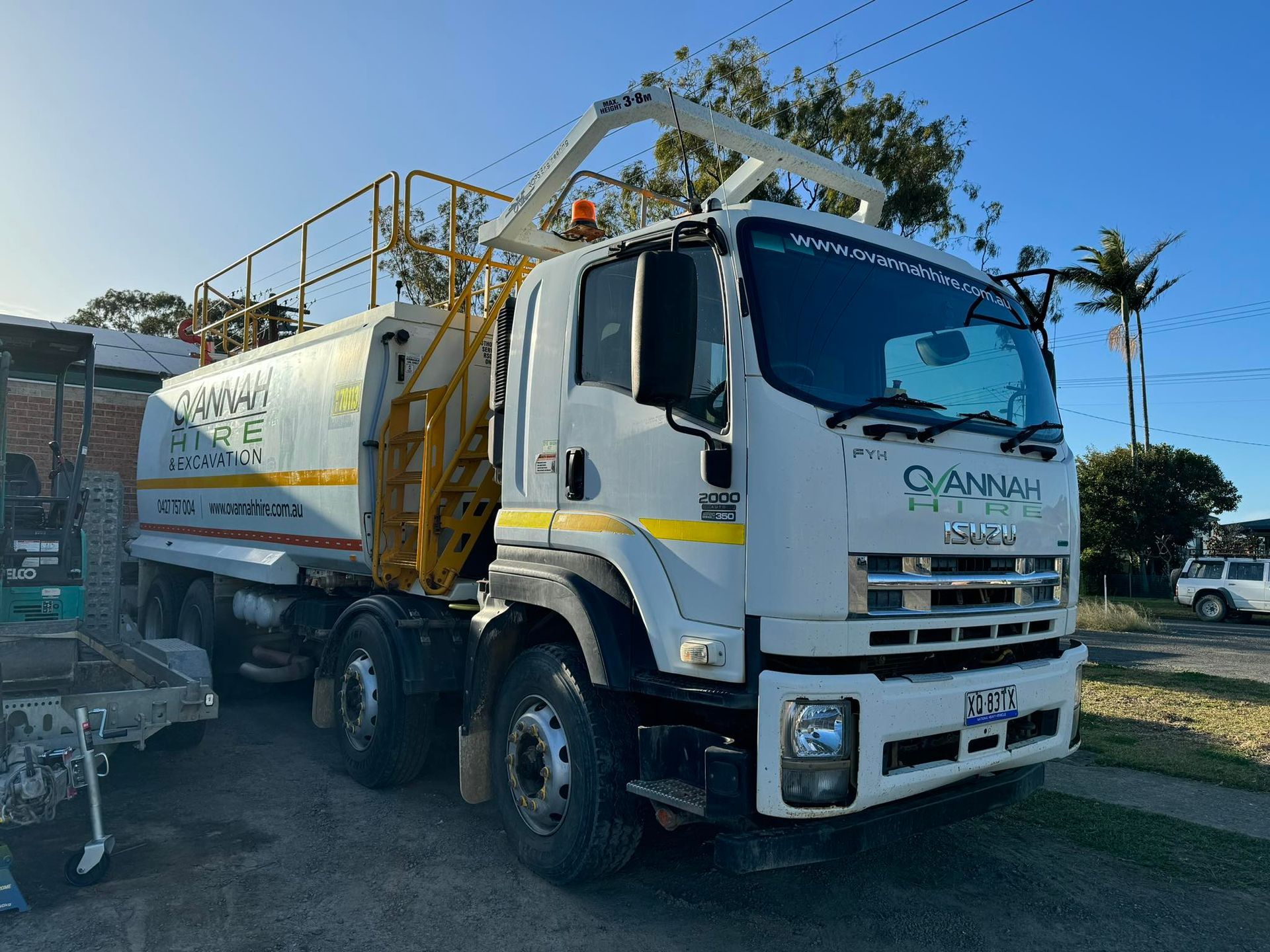White Truck With Large Tank and Elevated Work Platform Parked Outside — Ovannah Hire In West Kempsey, NSW