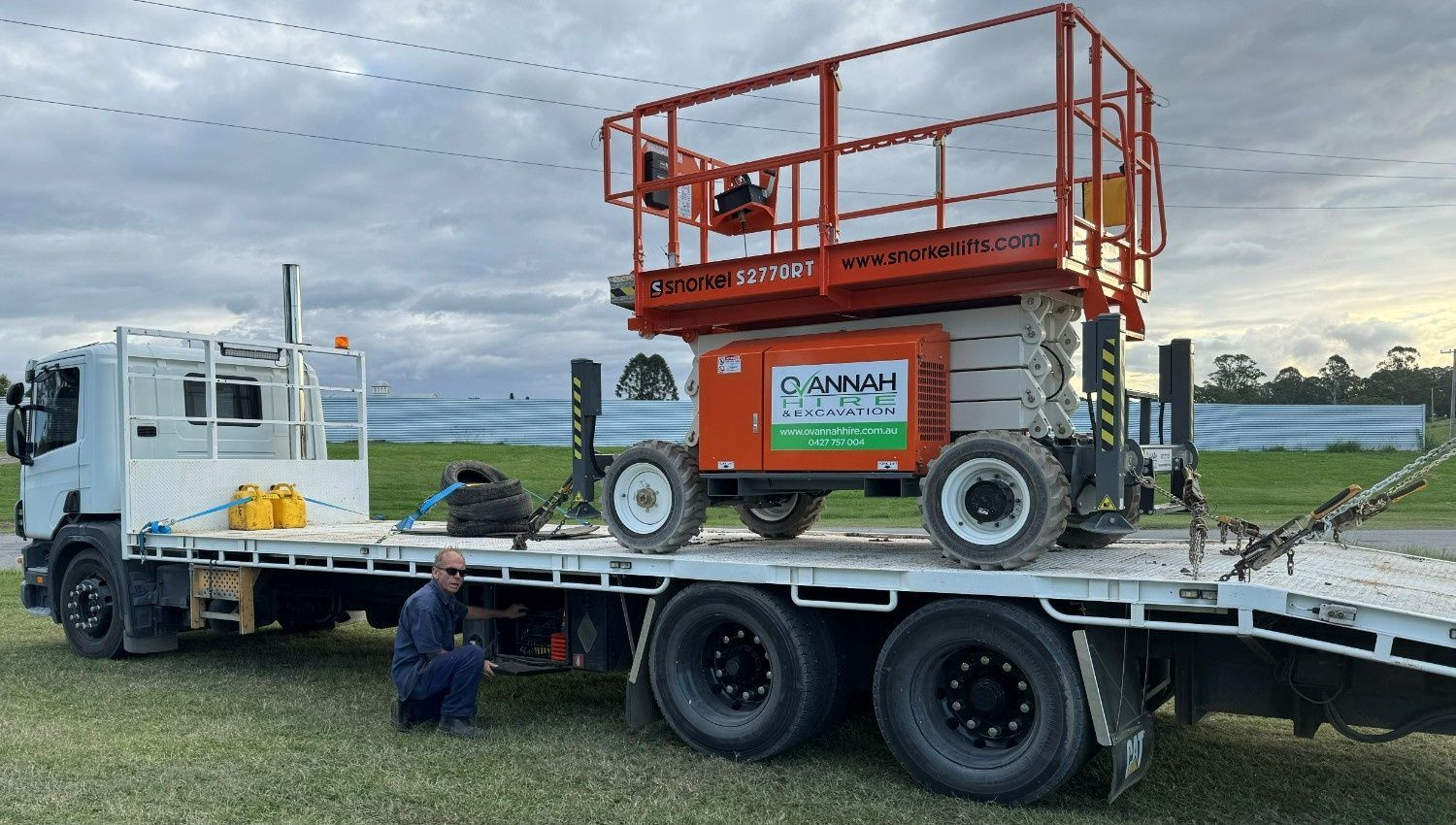 A Flatbed Truck Parked on Grass — Ovannah Hire In West Kempsey, NSW