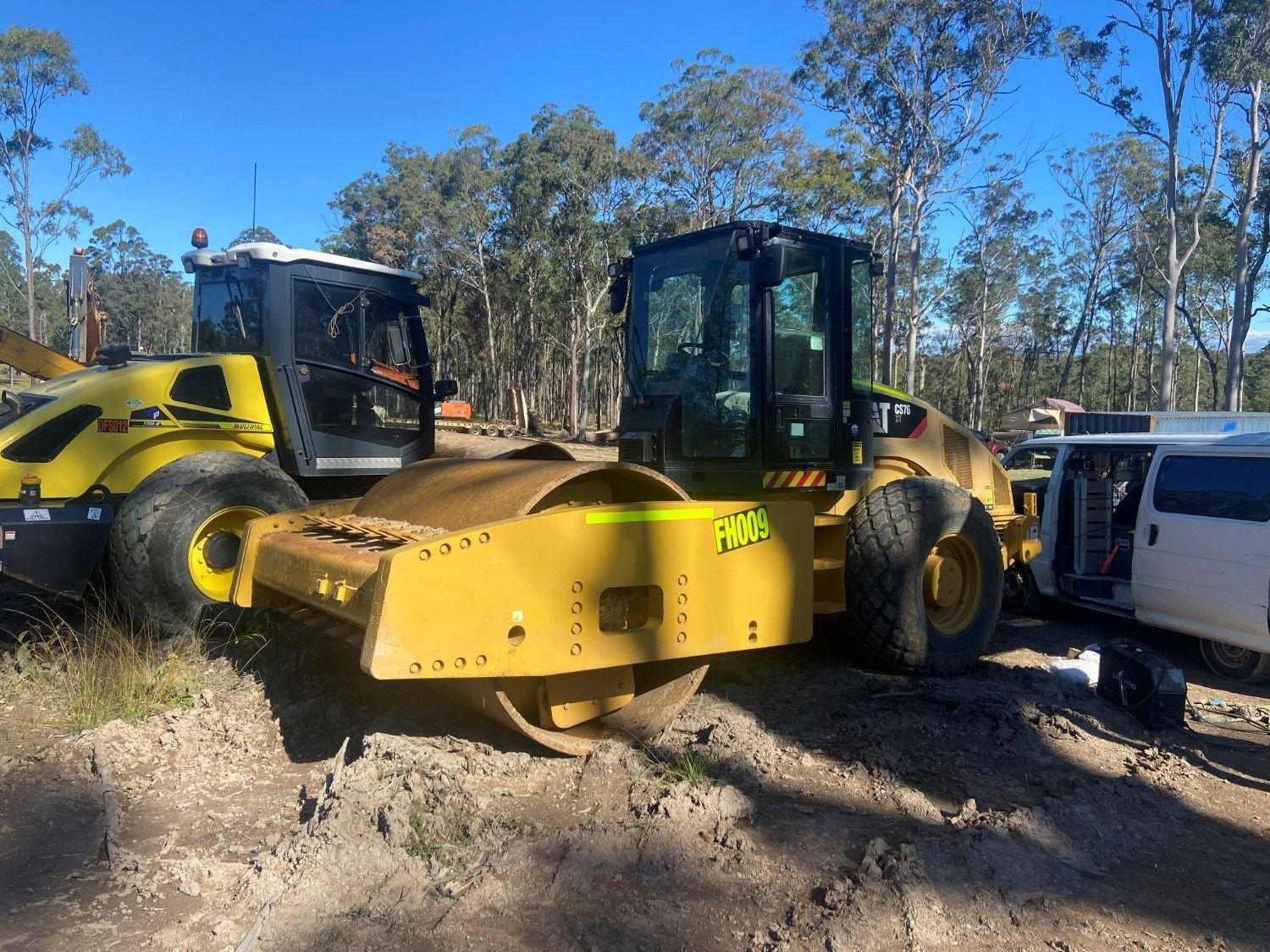A Yellow Construction Roller Parked on a Dirt Lot — Ovannah Hire In West Kempsey, NSW