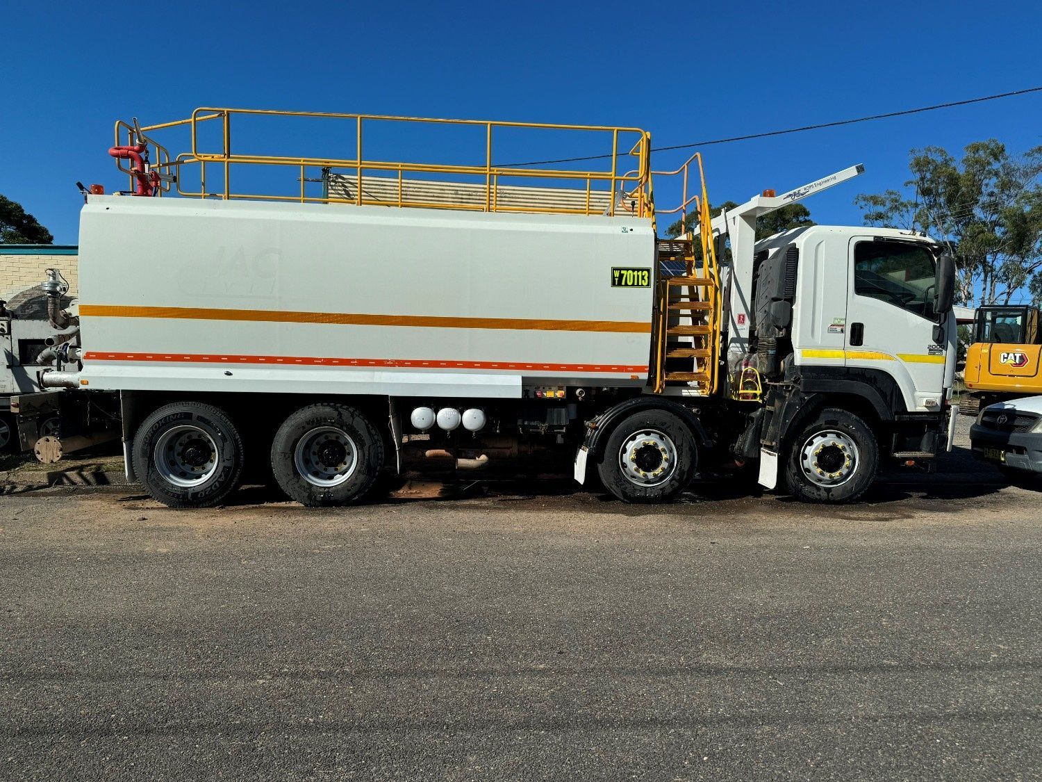 Side View of a White Multi-axle Industrial Water Tanker Truck — Ovannah Hire In West Kempsey, NSW