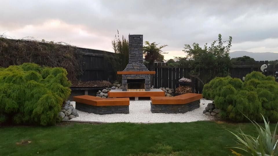 There is a fireplace in the middle of the garden.