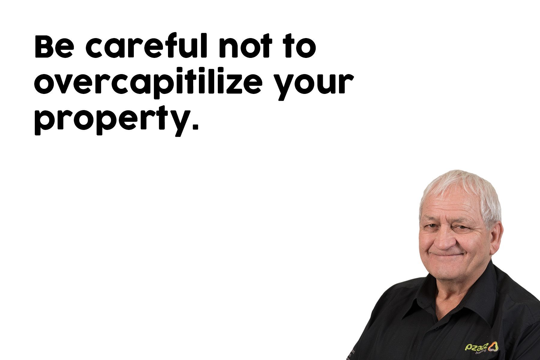 A man is standing in front of a sign that says `` be careful not to overcapitalize your property ''.