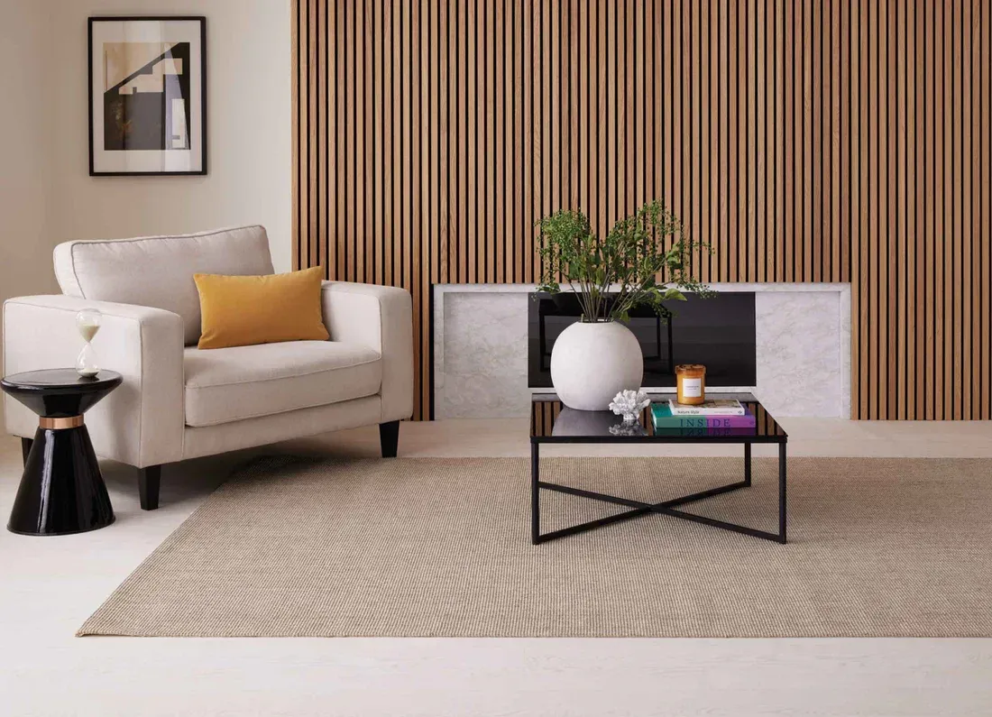 A living room with a couch and a coffee table