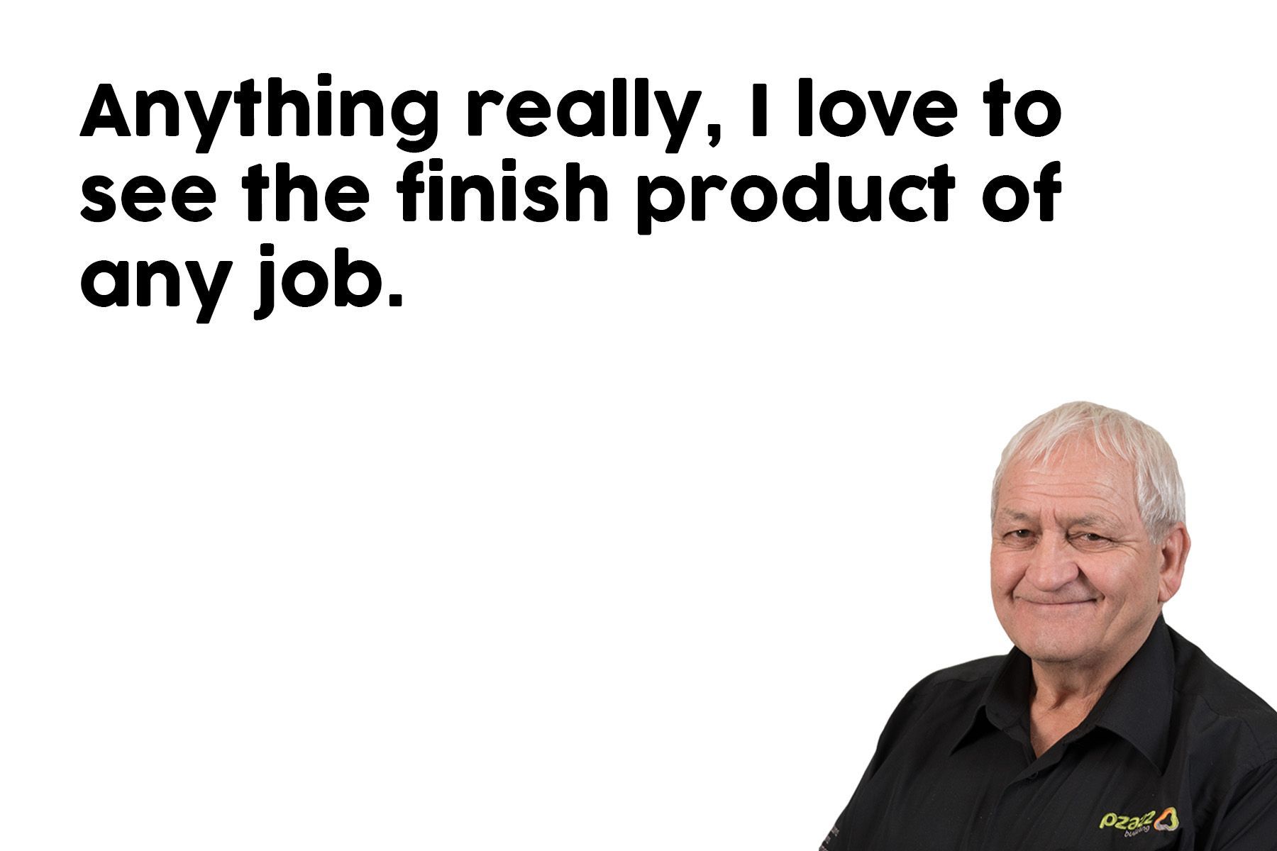 A man in a black shirt is smiling in front of a white background.