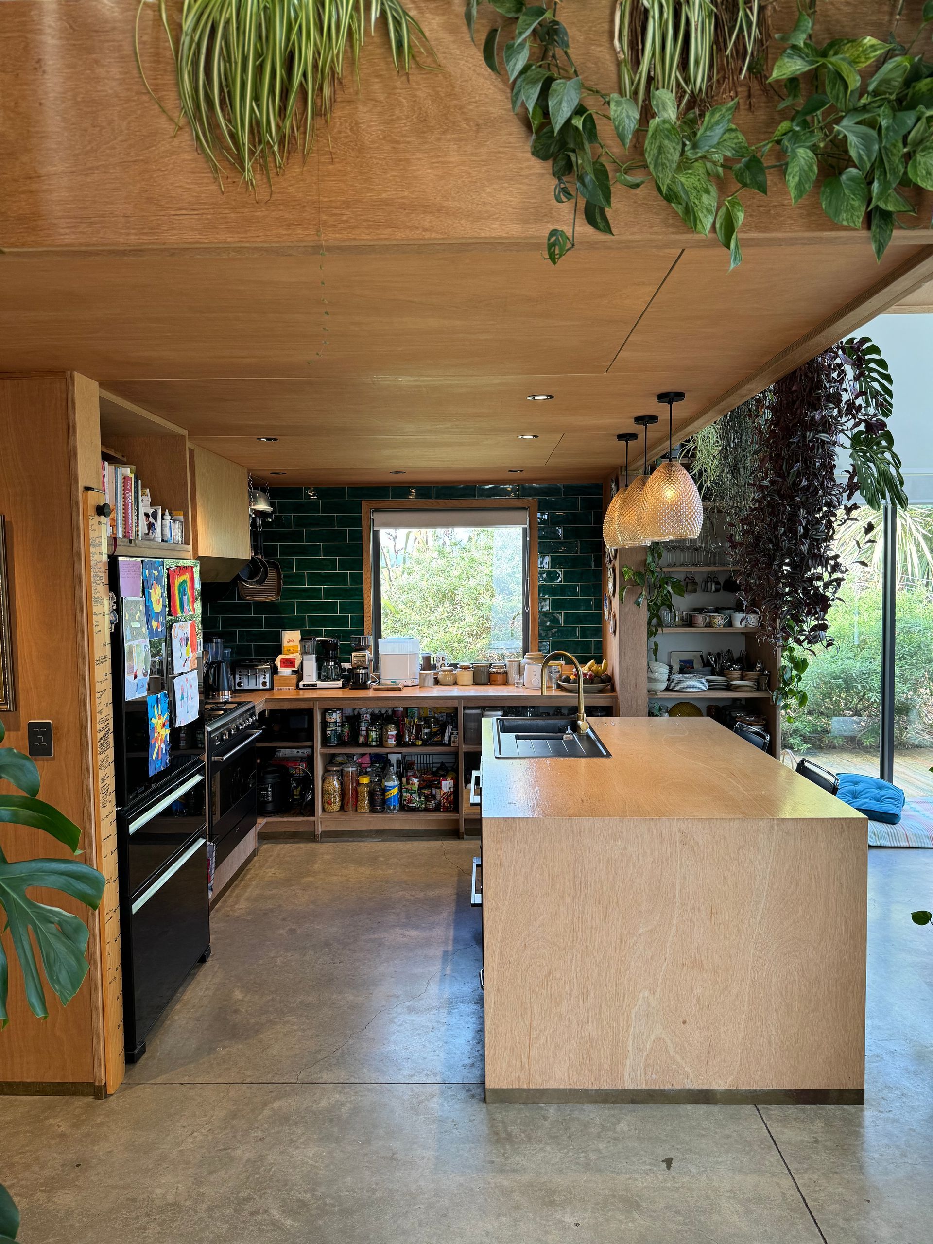 A kitchen with a large island in the middle of it