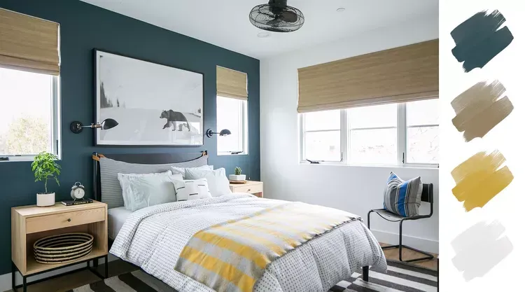 A bedroom with a bed and a painting on the wall.