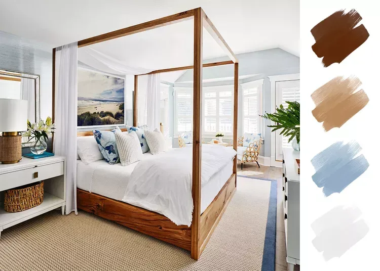 A bedroom with a canopy bed and a painting on the wall.