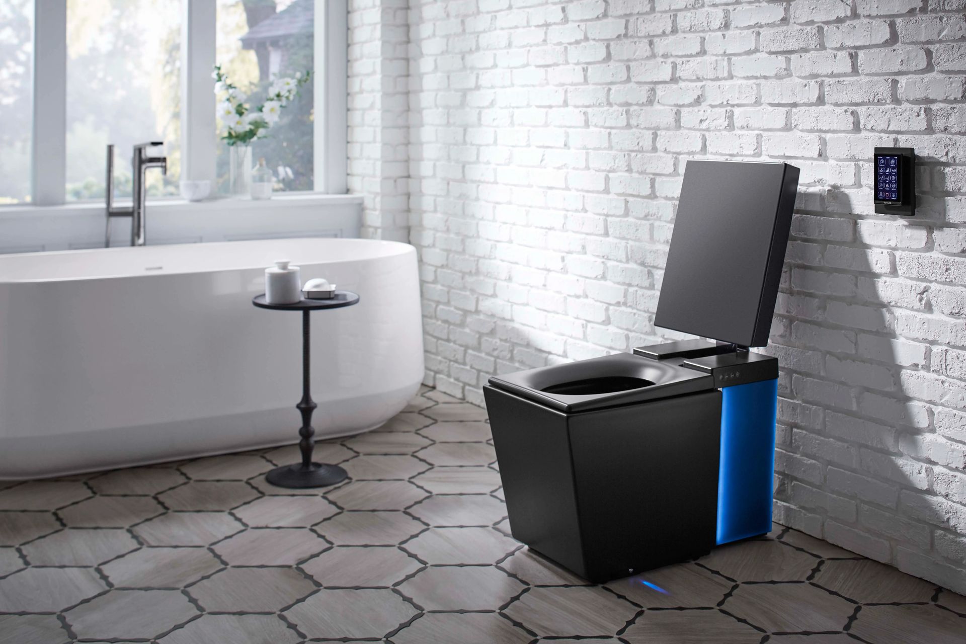 A black toilet is sitting in a bathroom next to a bathtub.