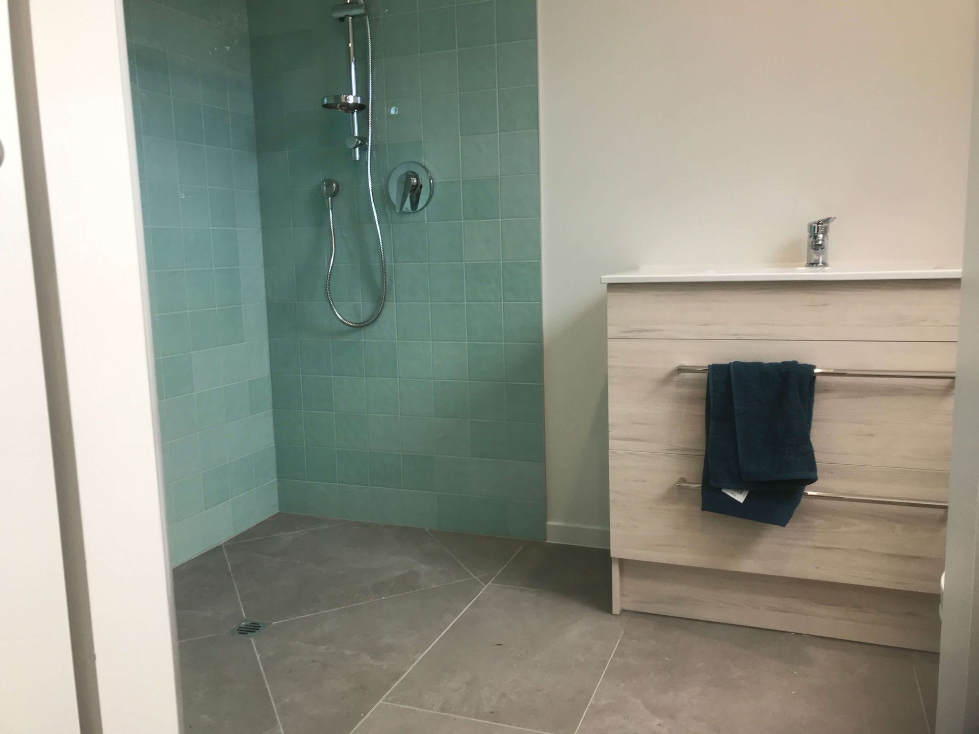 bathroom shower and vanity after