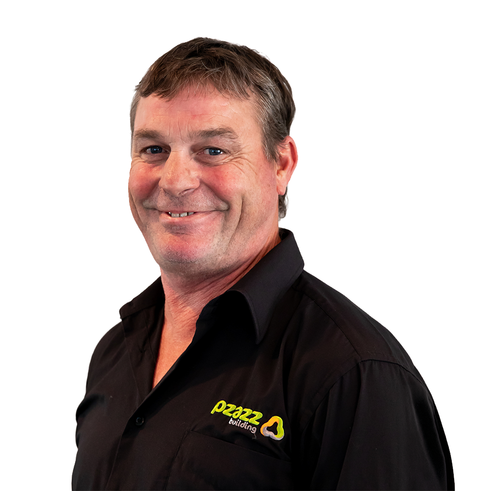 Allen Boyd wearing a gray and yellow polo shirt is standing in front of a white background.