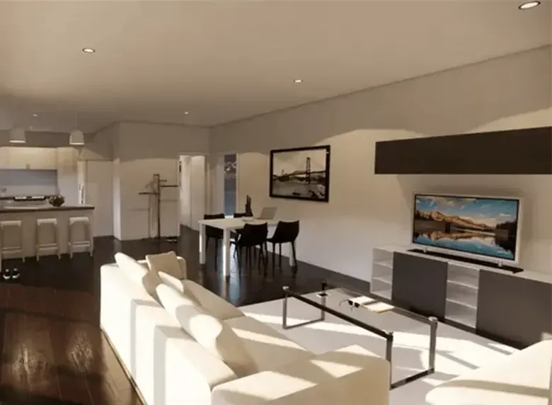 A living room with a white couch and a flat screen tv
