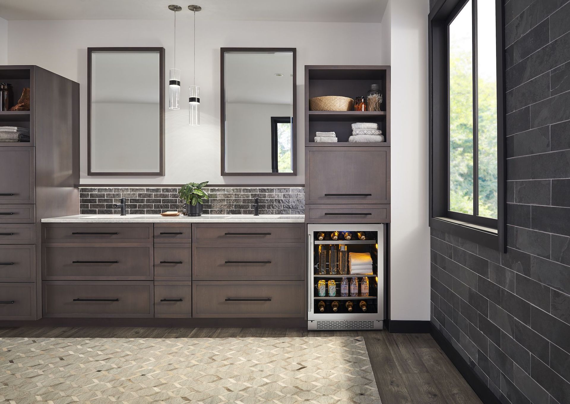 A bathroom with two sinks and a refrigerator