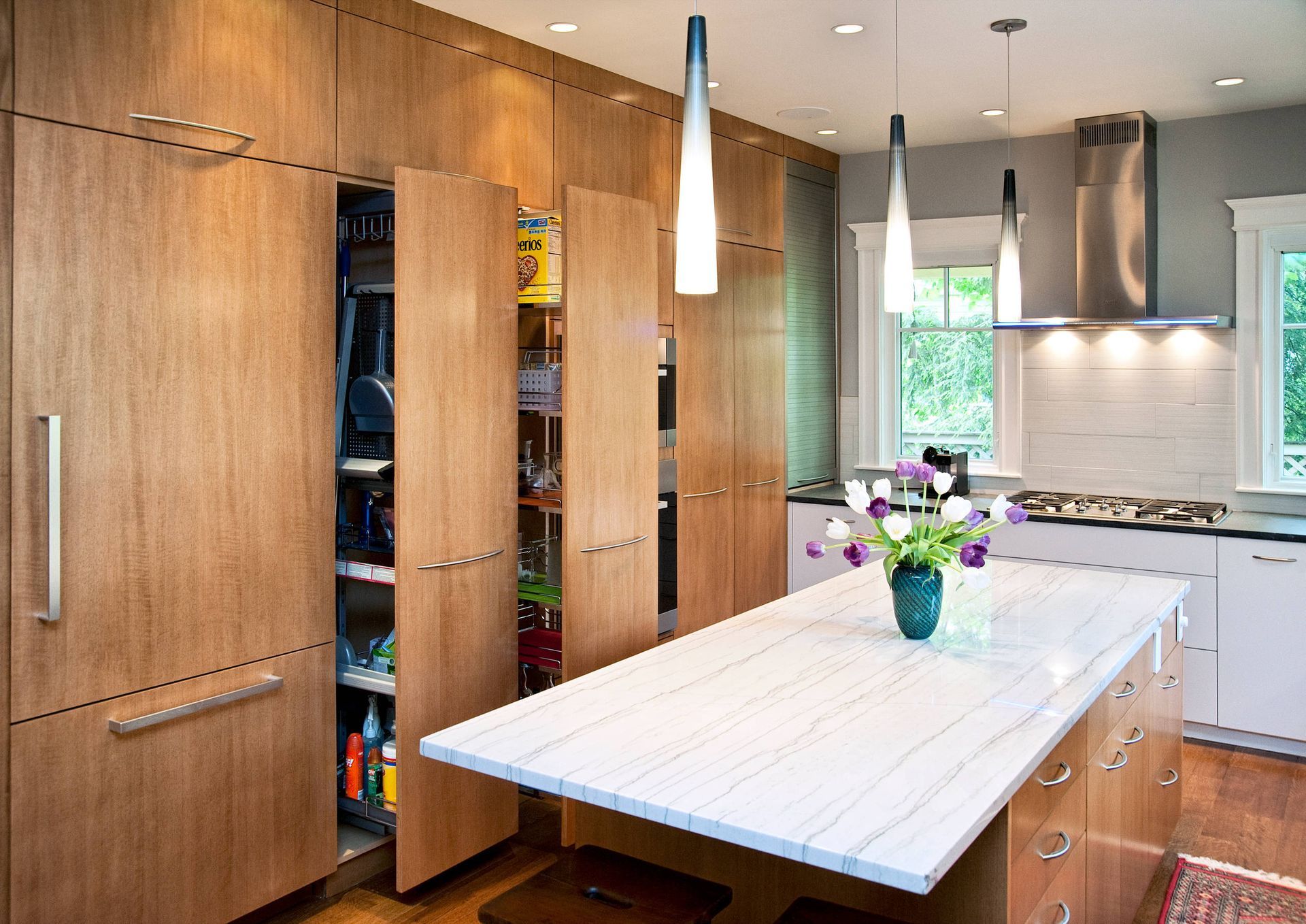 A kitchen with a large island and lots of cabinets