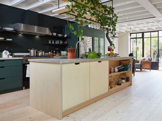 A kitchen with a large island in the middle of the room.