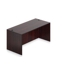 A wooden desk is sitting on top of a white surface.