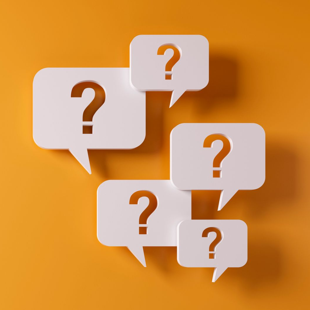 Five white speech bubbles with brown question marks on an orange background