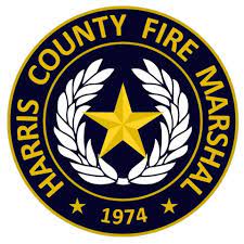The logo for the harris county fire marshal has a star and laurel wreath.