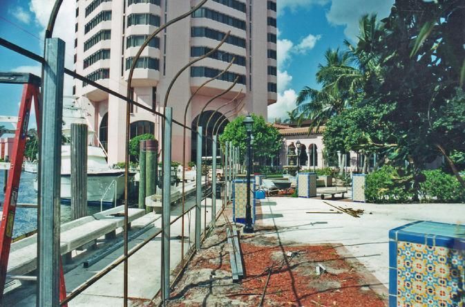 A fence is being built in front of a tall building