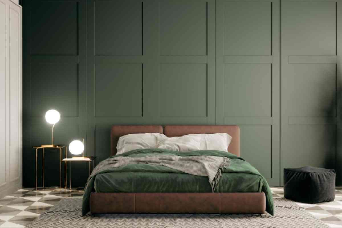 A dark green-themed modern bedroom with ambient lighting and a greenery plant in the space at The Blind Guy Lewiston near Clarkston & Pullman, WA