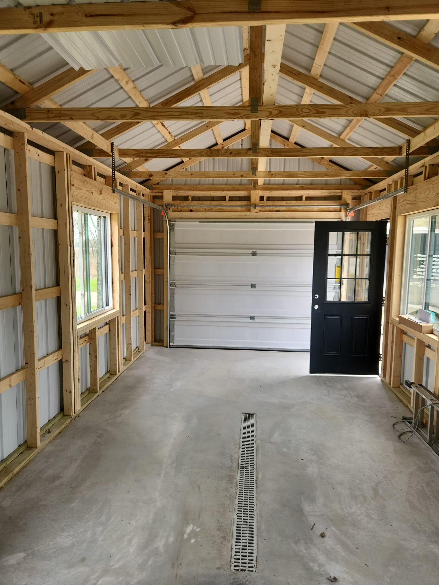 Interior view of a new garage under construction with a con
