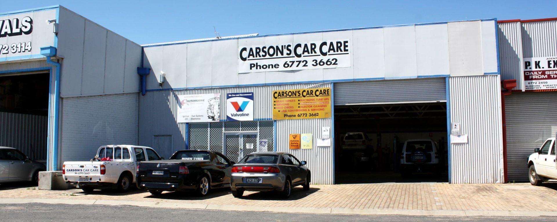 Cars are parked in front of a carson 's car care building — Carson's Car Care In Armidale, NSW