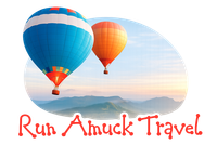 Run Amuck Travel logo with two colorful hot air balloons over a mountain landscape.