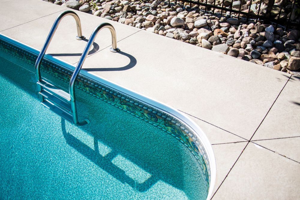 A Swimming Pool With Stairs and a Heart Shaped Shadow on the Side — Tweed Pool Shop in Casuarina, NSW