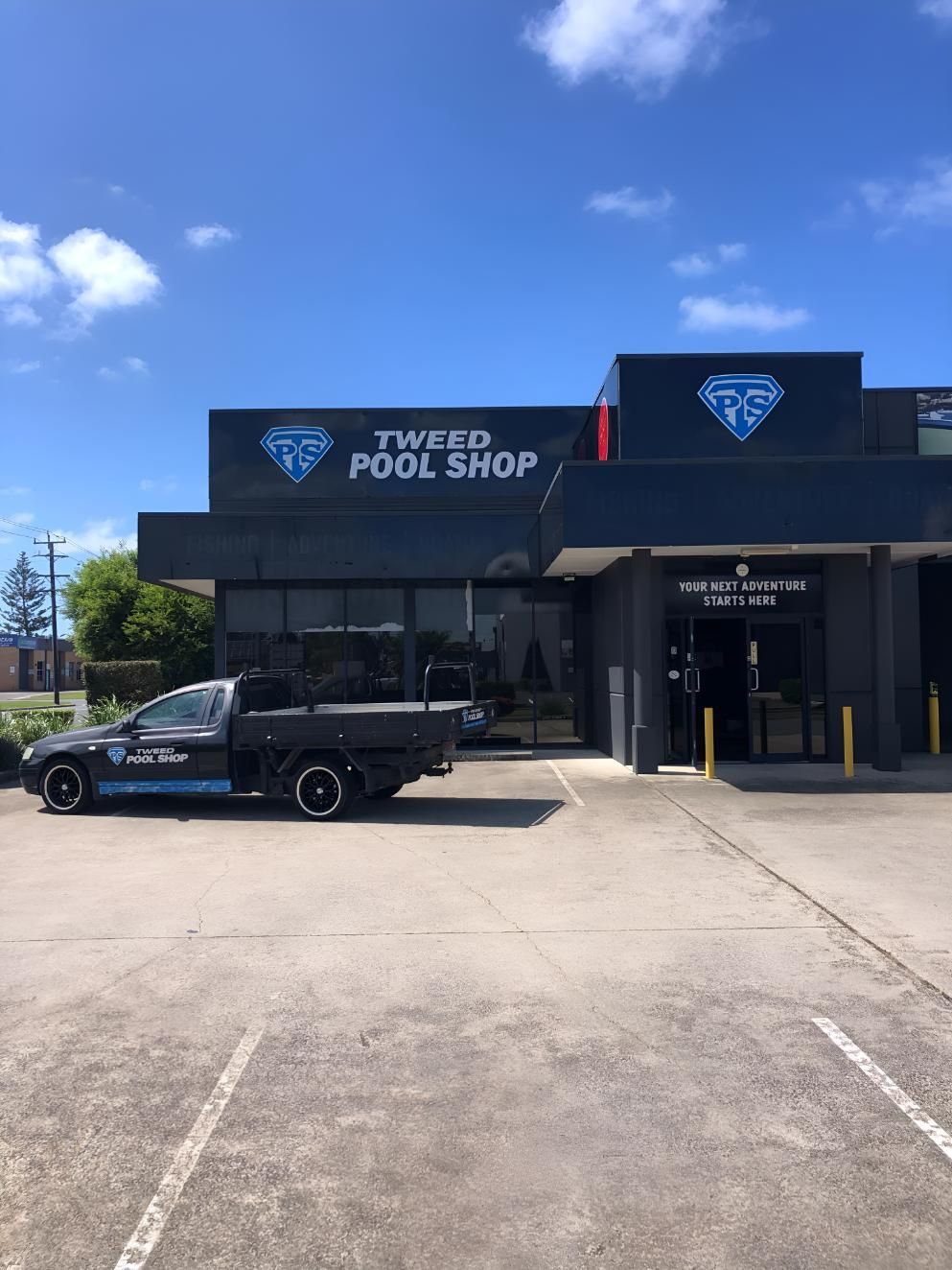 Car is Parked in Front of a Building That Says Pool Shop — Tweed Pool Shop in Tweed Heads South, NSW