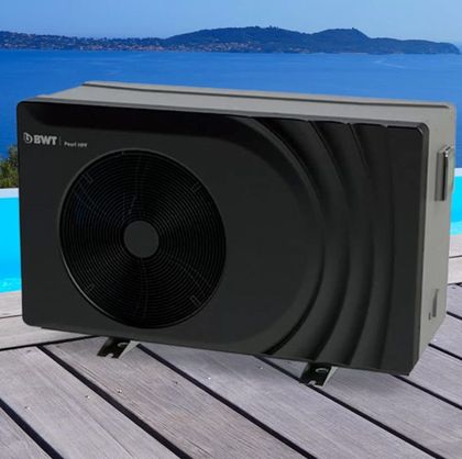 Pool heat pump, black and grey, on wooden deck by a pool and water with a mountain backdrop. — Tweed Pool Shop in Tweed Heads South, NSW