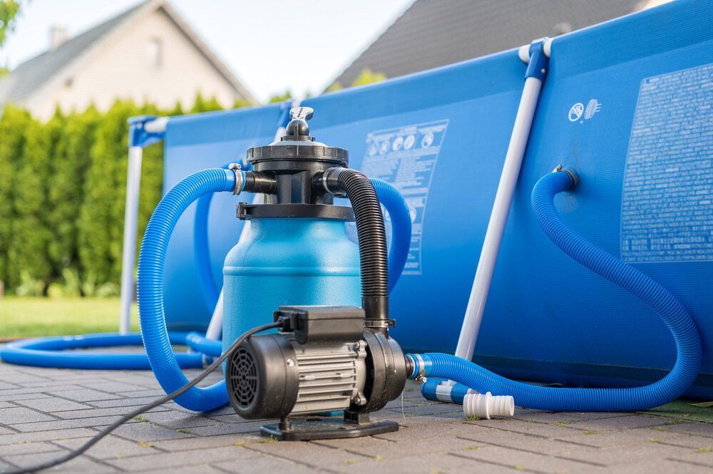 A Swimming Pool With a Filter and Pump Attached to It — Tweed Pool Shop in Currumbin, QLD