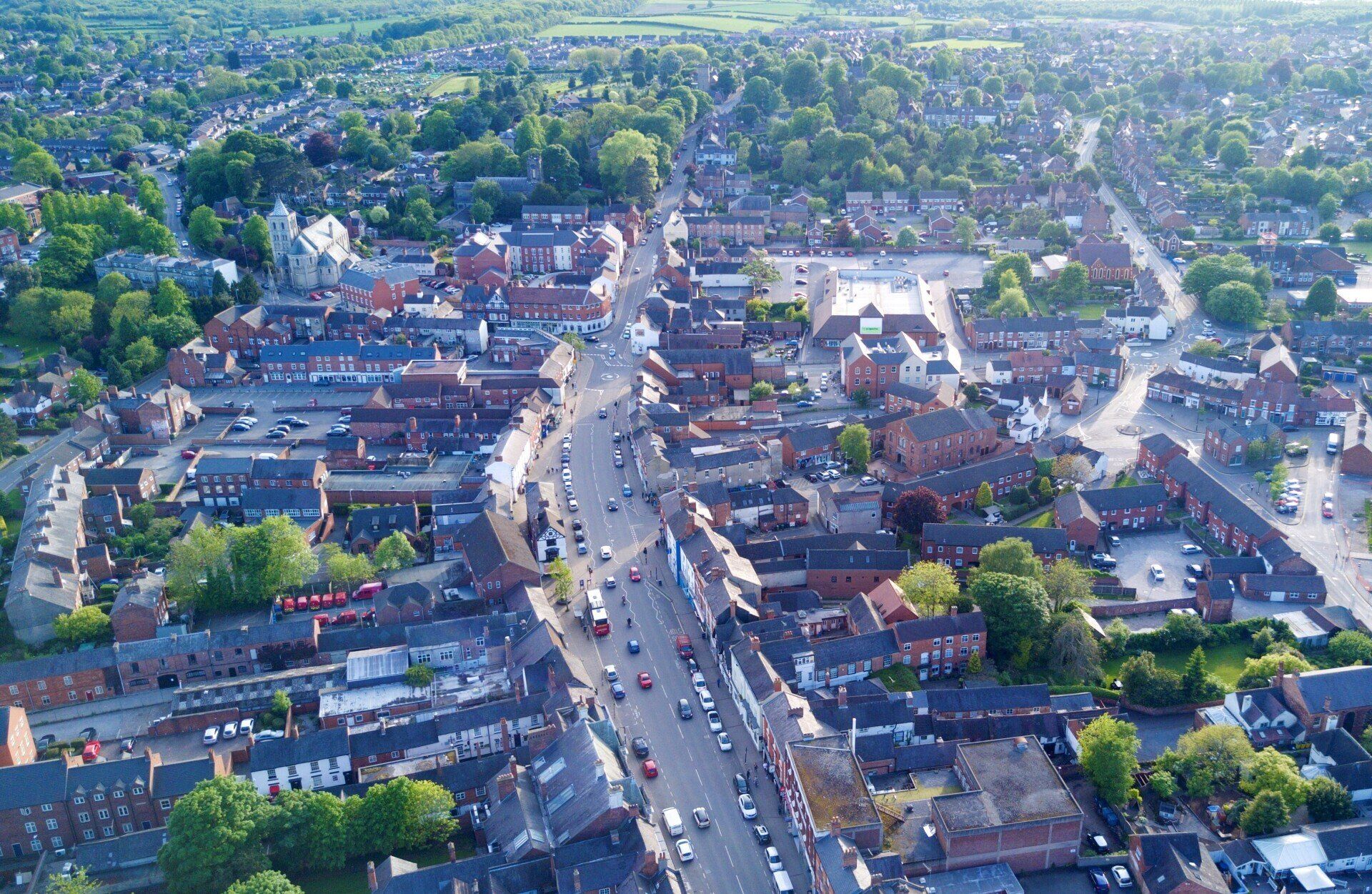 An aerial view of a city with lots of buildings and trees