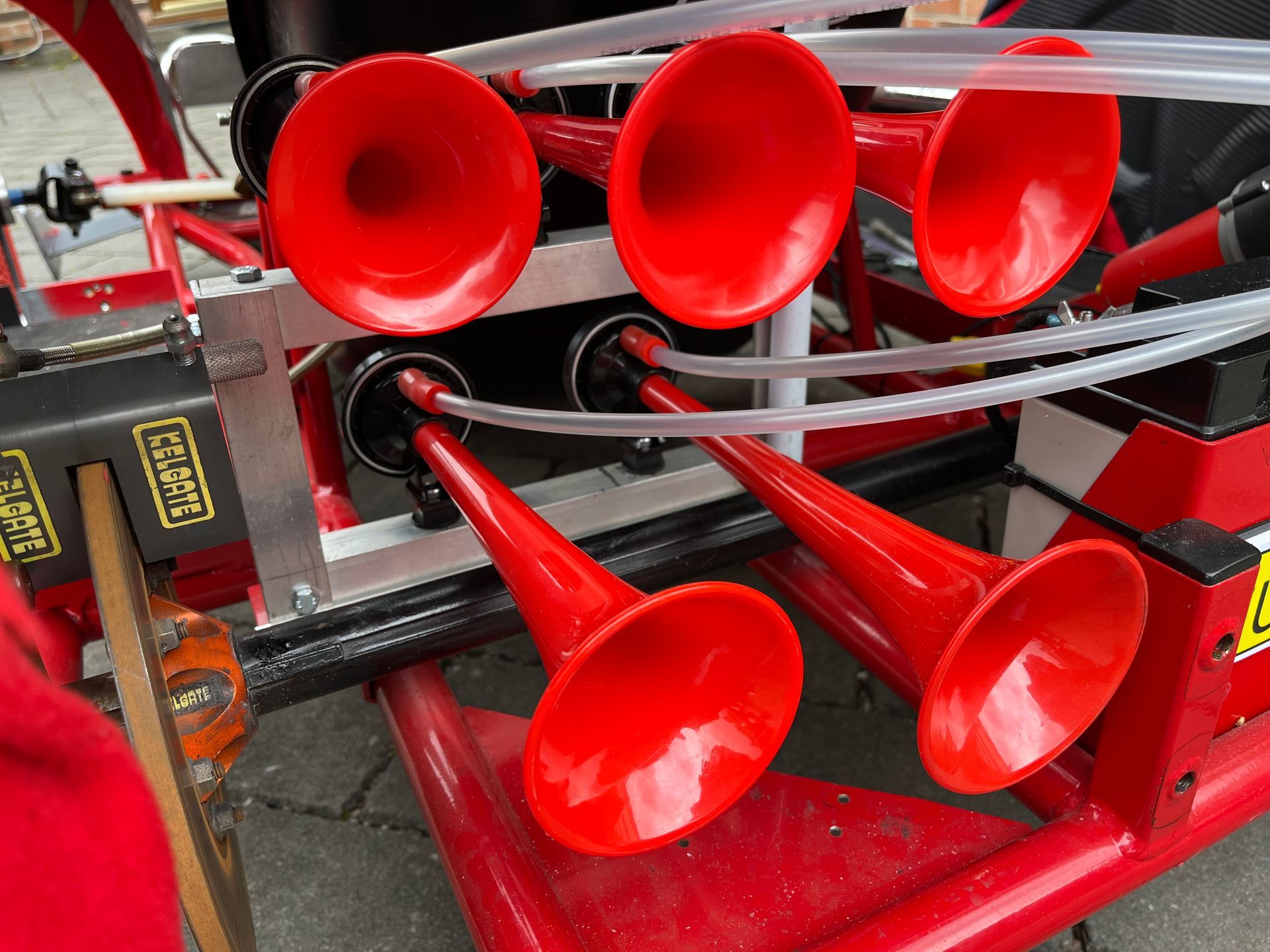 A bunch of red horns on a red vehicle