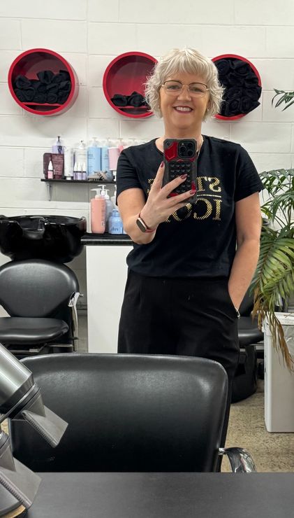 A Woman With Long Blonde Hair — Embellish Hair and Beauty In Slade Point, QLD