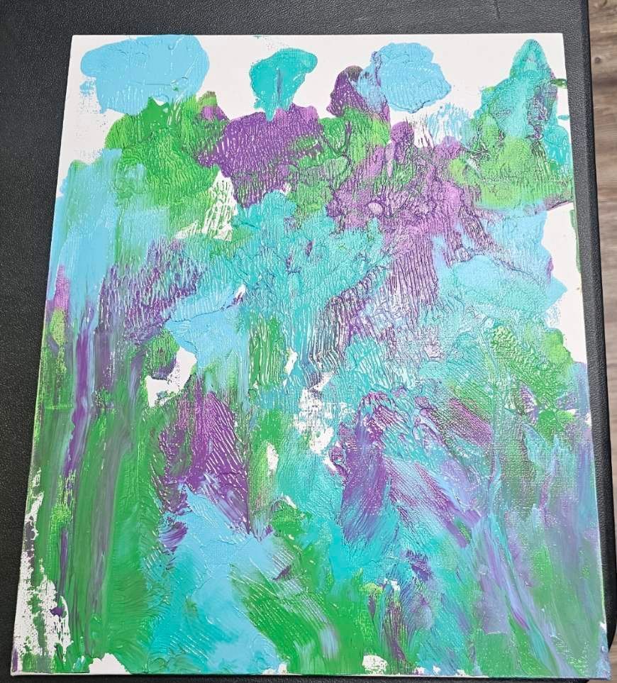 A custom painting with blue, green, and purple.