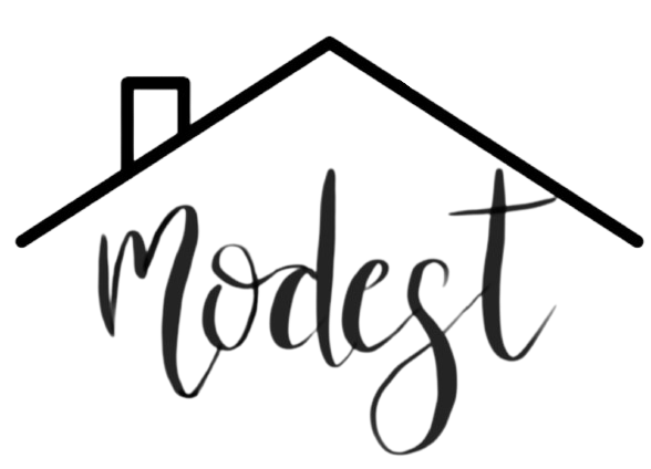 Logo with a house outline above the word