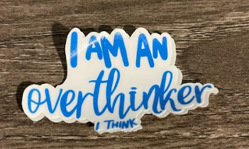 Blue and white sticker that says "I AM AN overthinker I THINK".