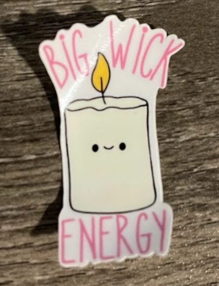 A sticker of a cute candle with a flame, smiling, with "Big Wick Energy" text in pink.