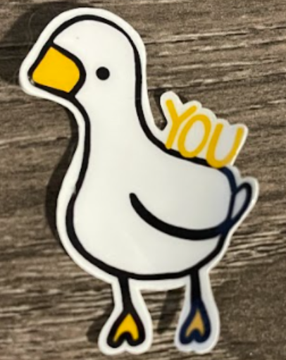 White cartoon goose with a yellow beak and "YOU" on its back.