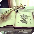 A book is open to a page with a drawing of a butterfly on it. A book is open to a page with a drawing of a butterfly on it.