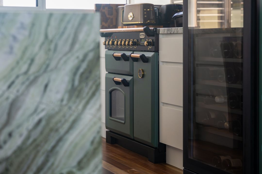 A Kitchen with Cabinets and Stainless Steel Appliances — Custombuilt Furnishers in Svensson Heights, QLD