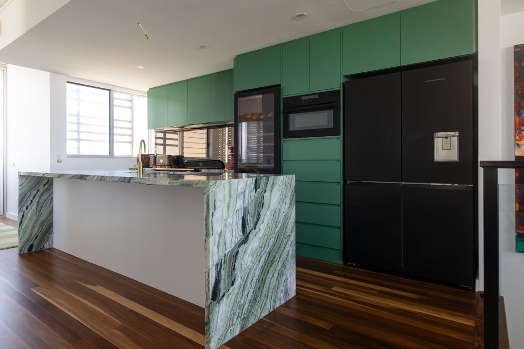 A Kitchen with Stainless Steel Appliances and Wooden Counter Tops — Custombuilt Furnishers in Svensson Heights, QLD