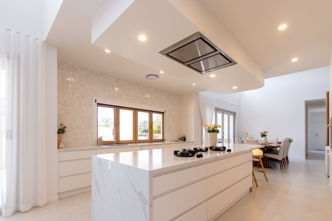 A Bathroom With a Toilet , Sink , Mirror and Shower — Custombuilt Furnishers in Svensson Heights, QLD
