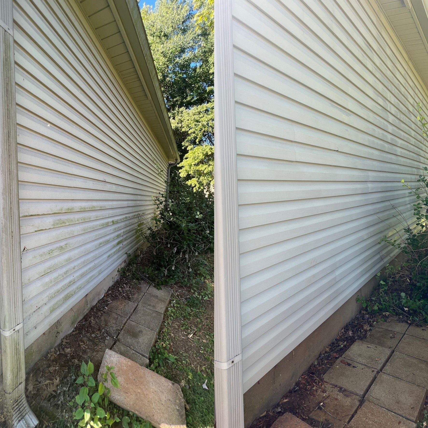 A before and after picture of a house 's siding being cleaned. - Bourbon City Softwash - Louisville, KY