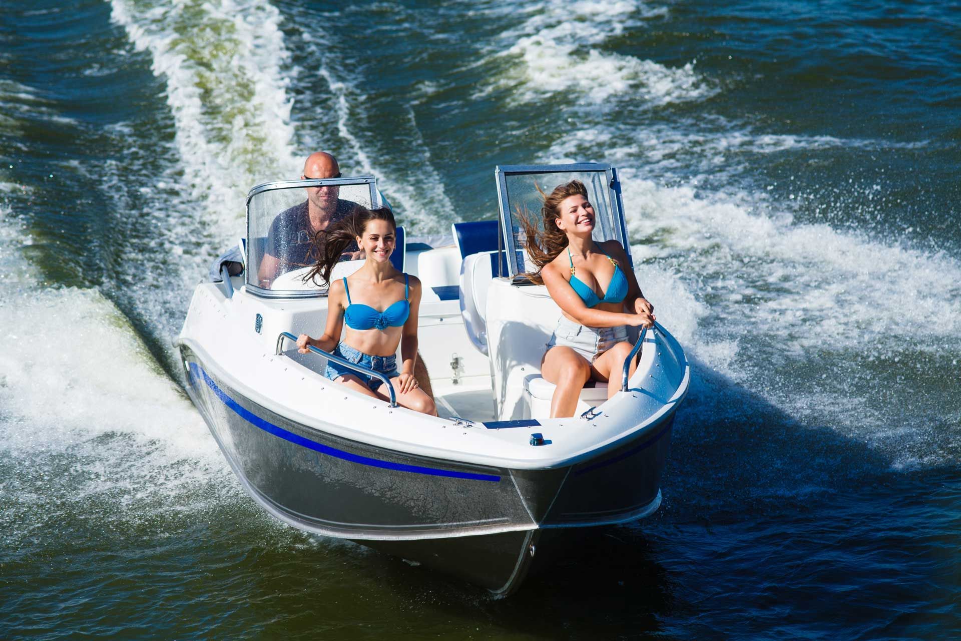 A group of people are riding a boat on a lake
