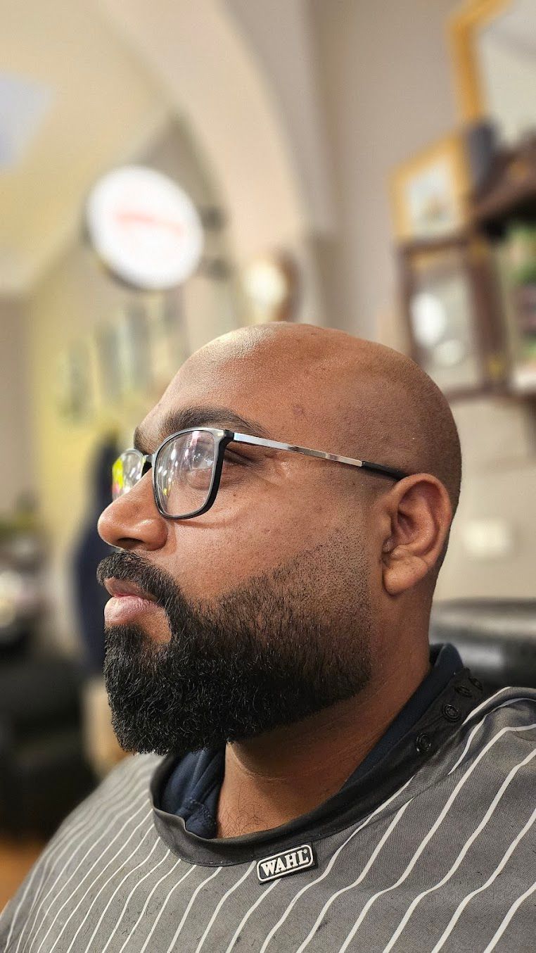 Man in Glasses and Black Beard in Profile — Lucky Child Barber Shop In Hobart, TAS