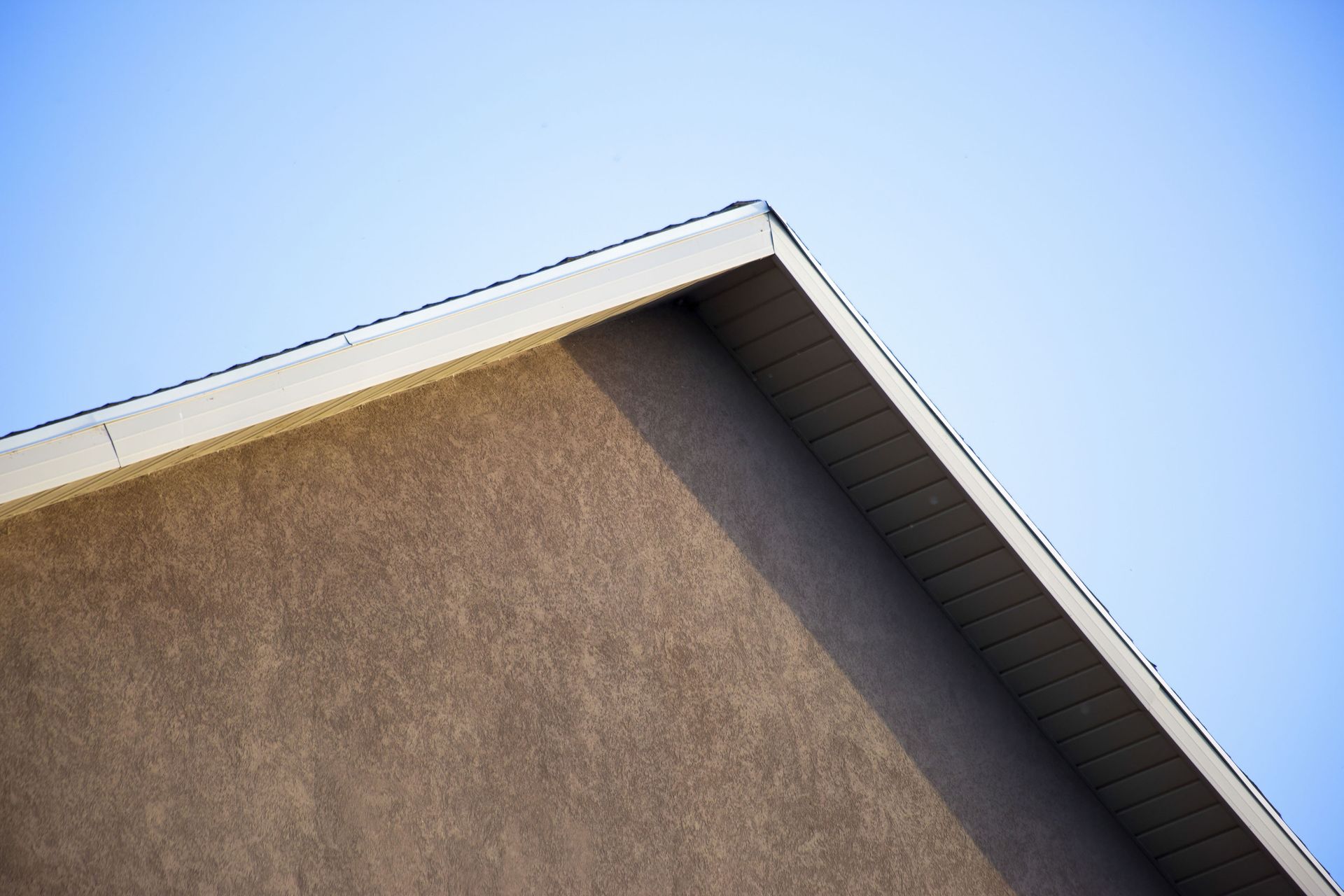 Vinyl fascia installed above florida seamless gutters on home exterior