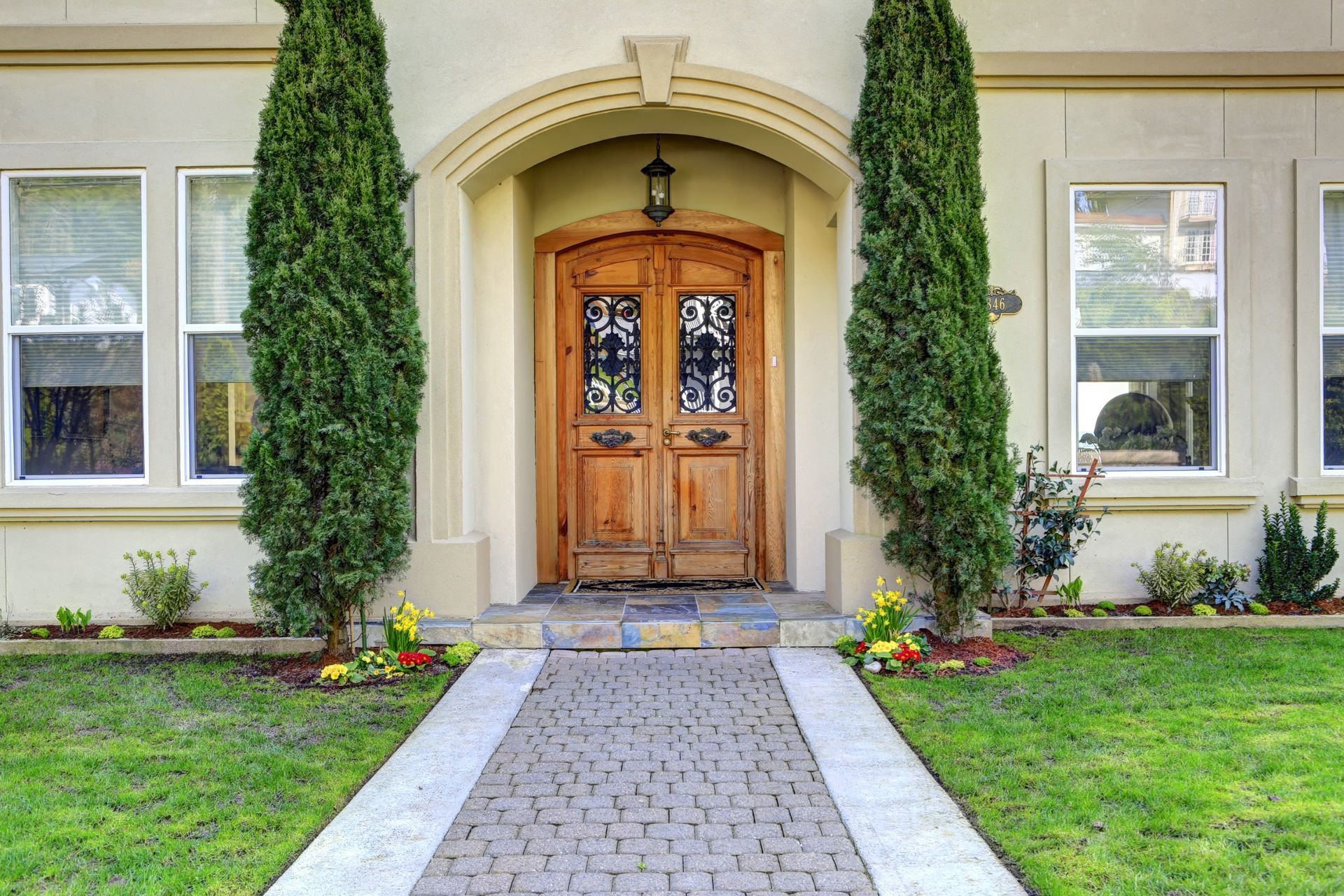 Luxury front entryway design with seamless gutters Parrish