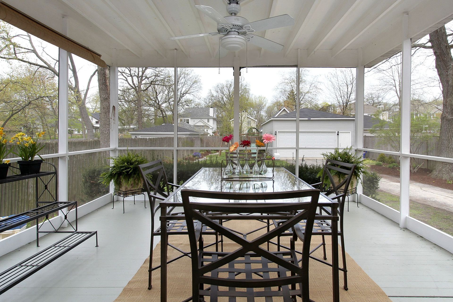 Screened lanai enclosure attached to home with florida seamless gutters